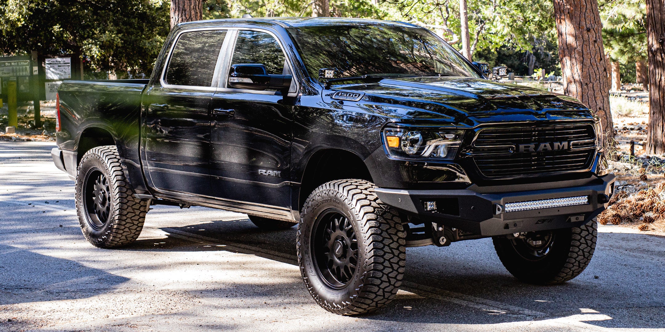 Black Dodge Ram 1500 4x4 with Body Armor front and rear bumpers.