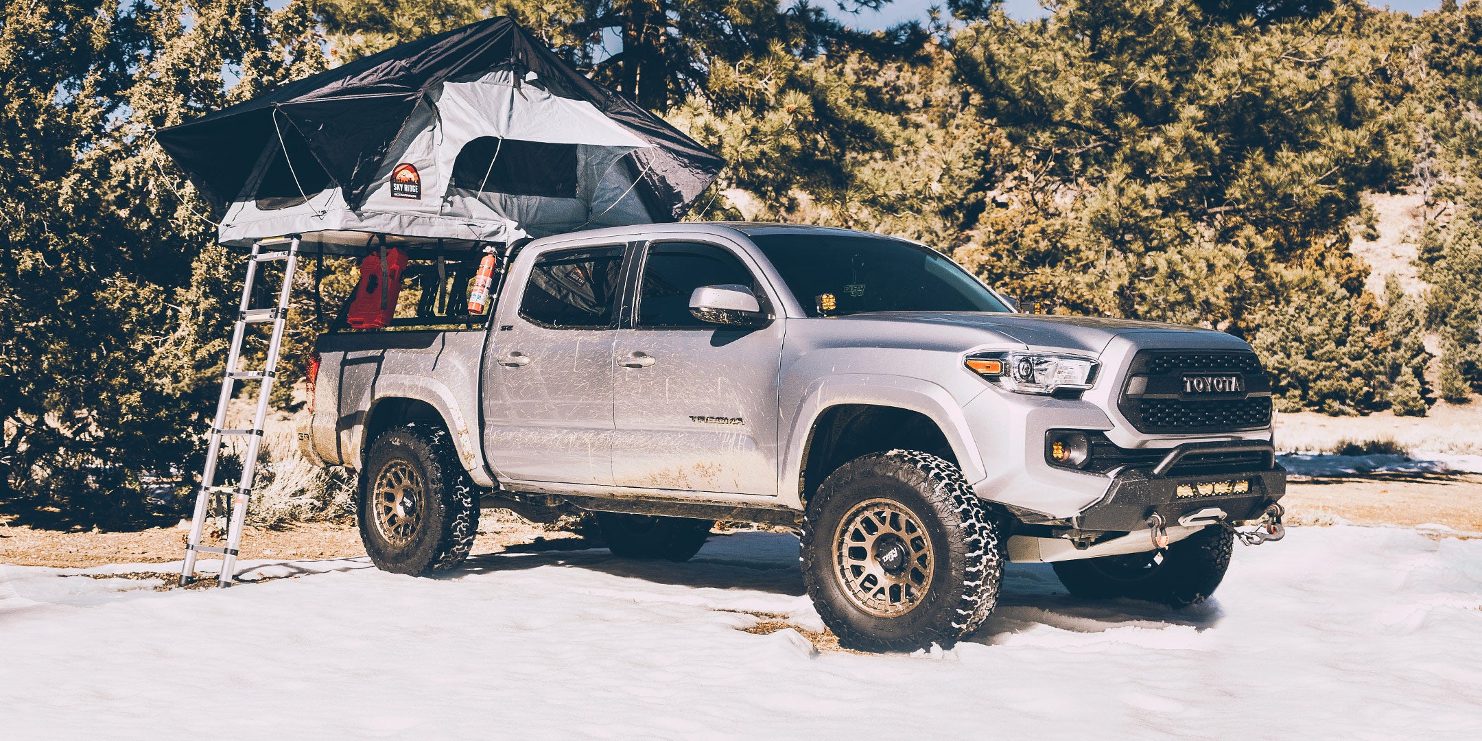 Body Armor 4x4 Sky Ridge roof top tent on the Toyota Tacoma Bed Rack. 