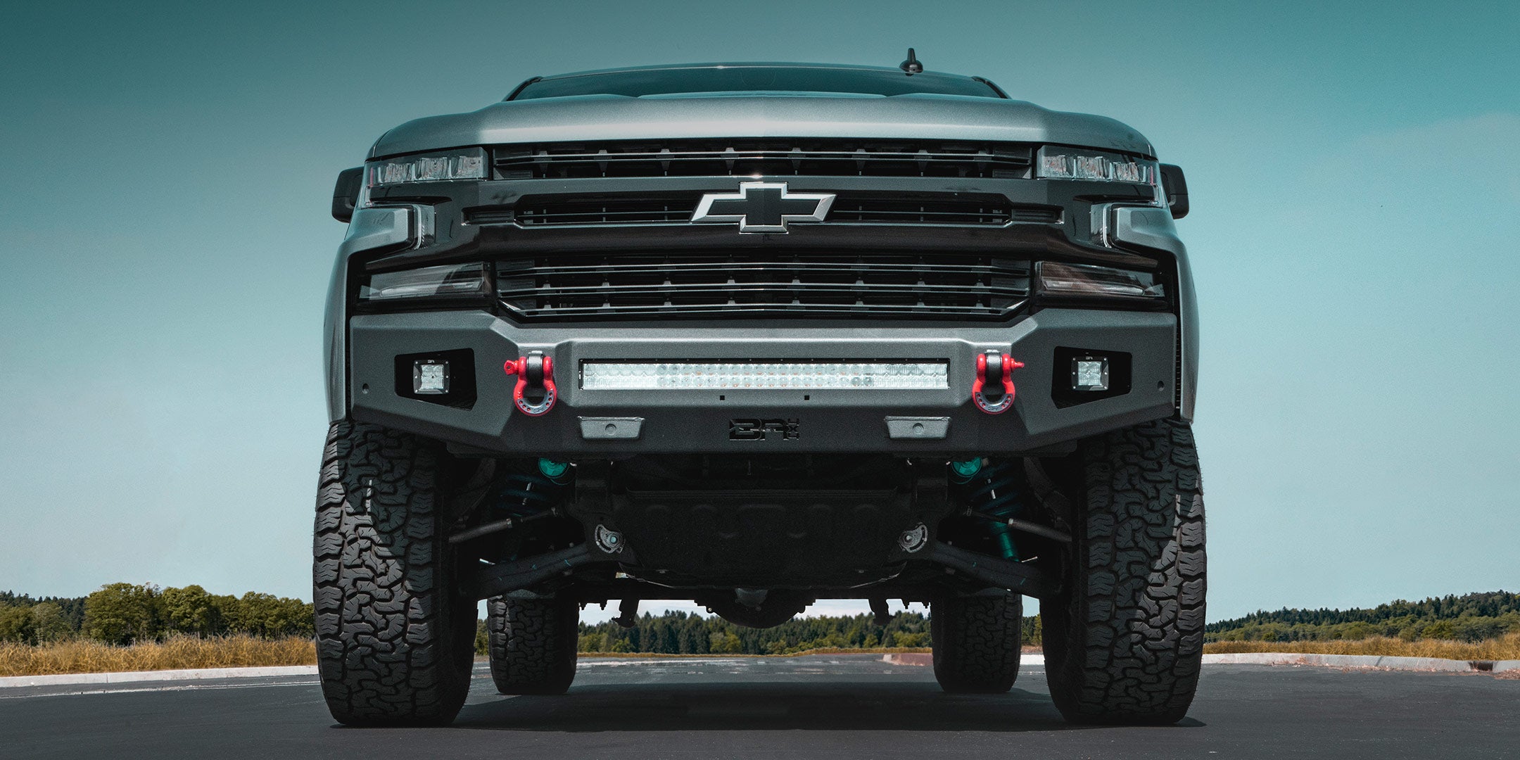 Chevrolet Silverado 1500 with Body Armor 4x4 Ambush front bumper, Body Armor 4x4 D-rings, light bars and light cubes.